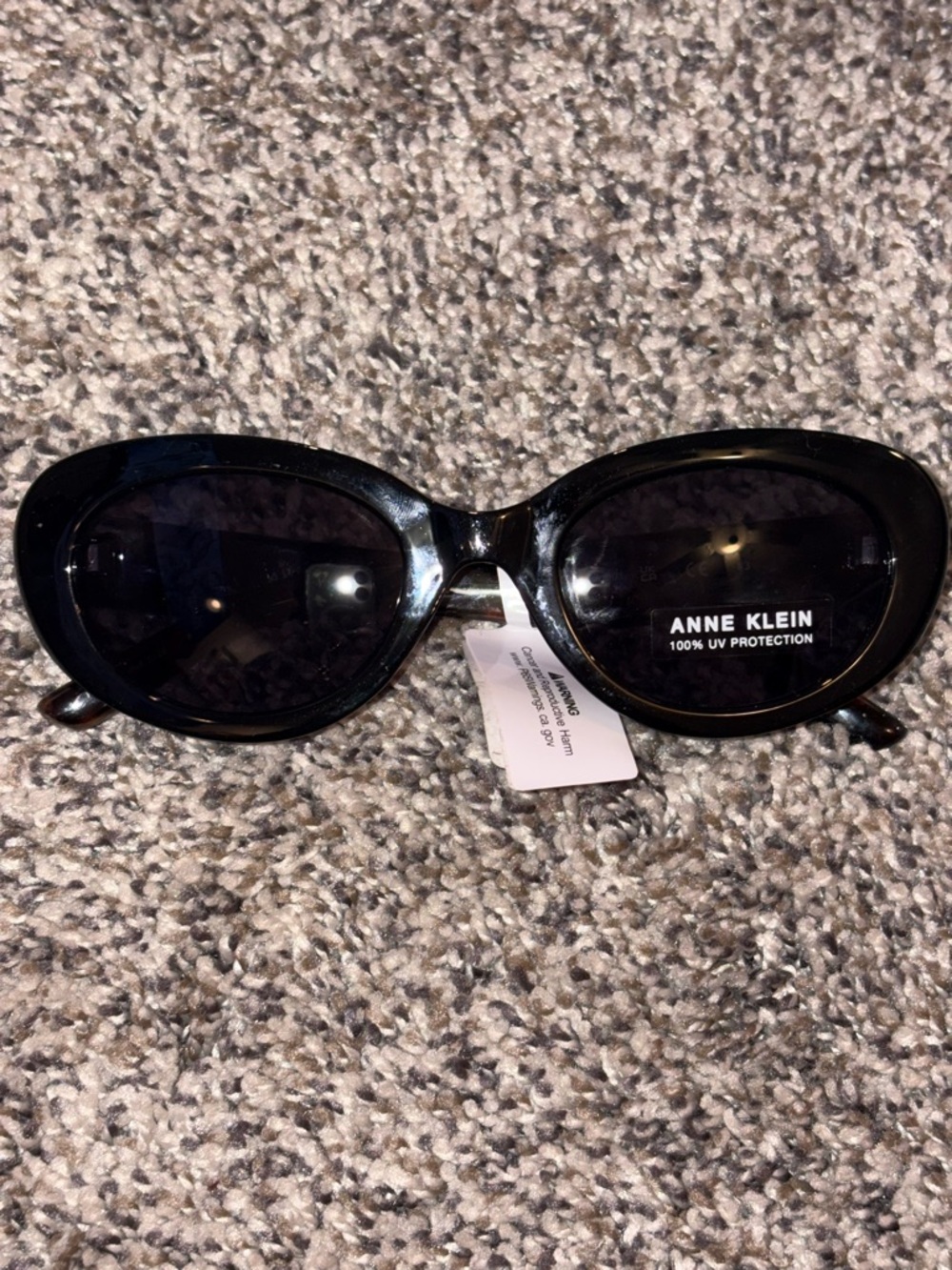 Anne Klein Glossy Black Oval Sunglasses